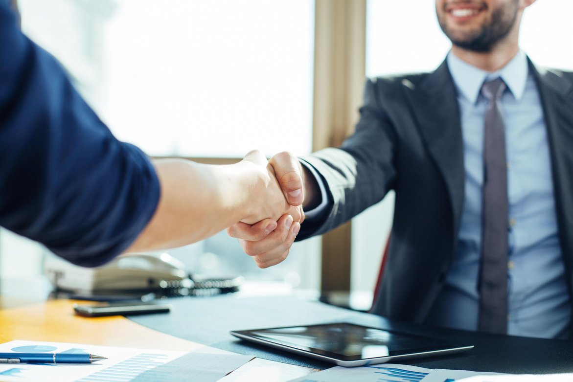 81808080 - Close up of business handshake in the office.jpeg